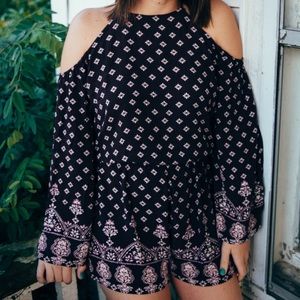 Open shoulder romper.